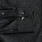 Washed black Slater denim shirt sleeve and cuff detail - smoke buttons