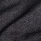 Washed black Slater denim fabric close-up - 100% cotton texture