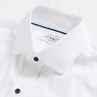 Custom dress shirt collar detail with navy buttons - Journey Flex white performance fabric construction