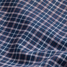Journey Flex navy check dress shirt fabric close-up - wrinkle-resistant performance material