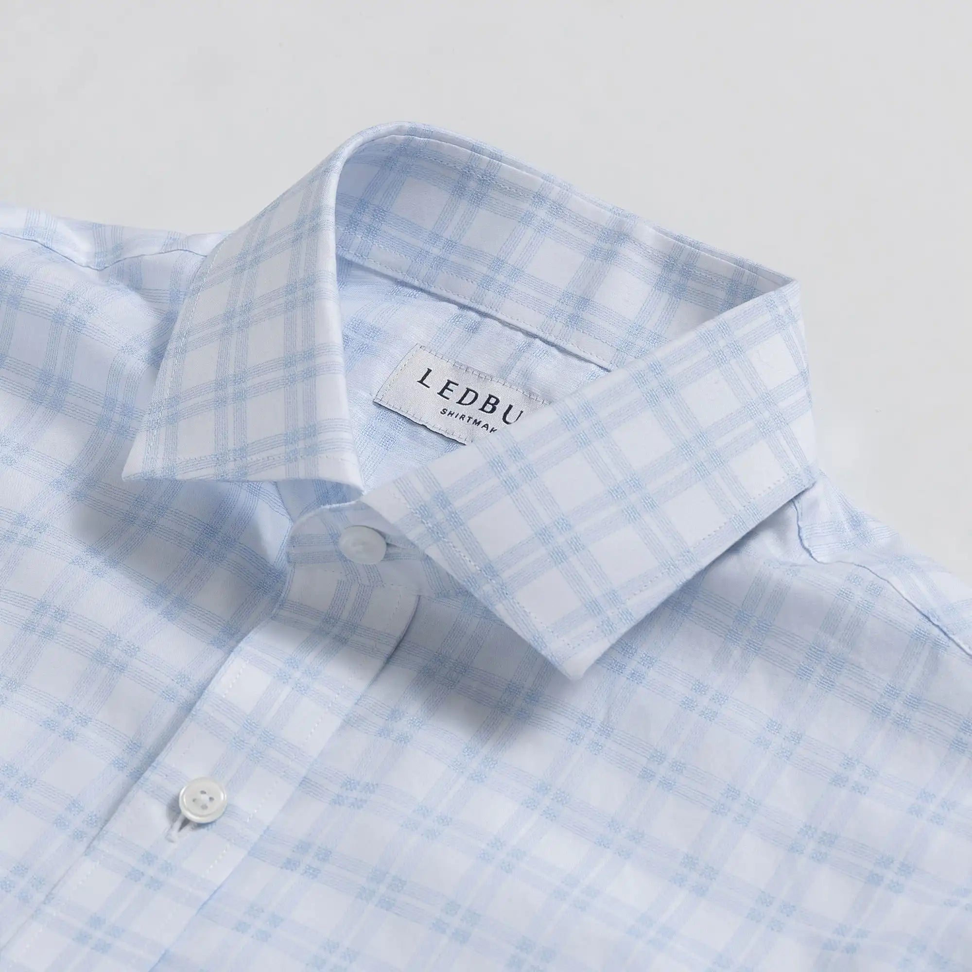 Sky blue plaid dress shirt collar detail - lightweight cotton construction