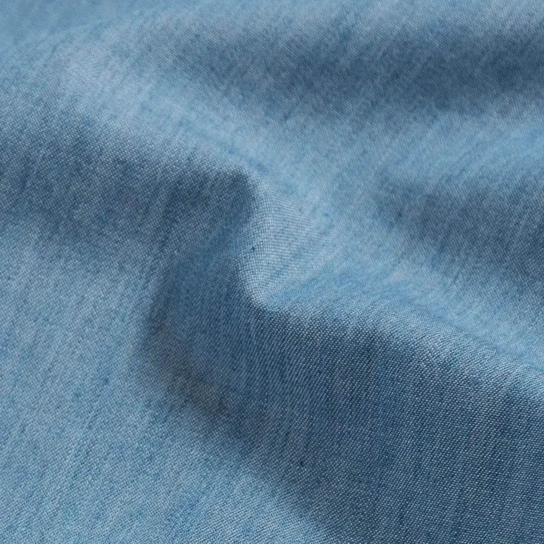 Blue Nelson chambray fabric close-up - faux indigo dye texture