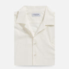 Cream oxford chambray camp collar shirt, front view, lightweight slub cotton, worn untucked | Ledbury