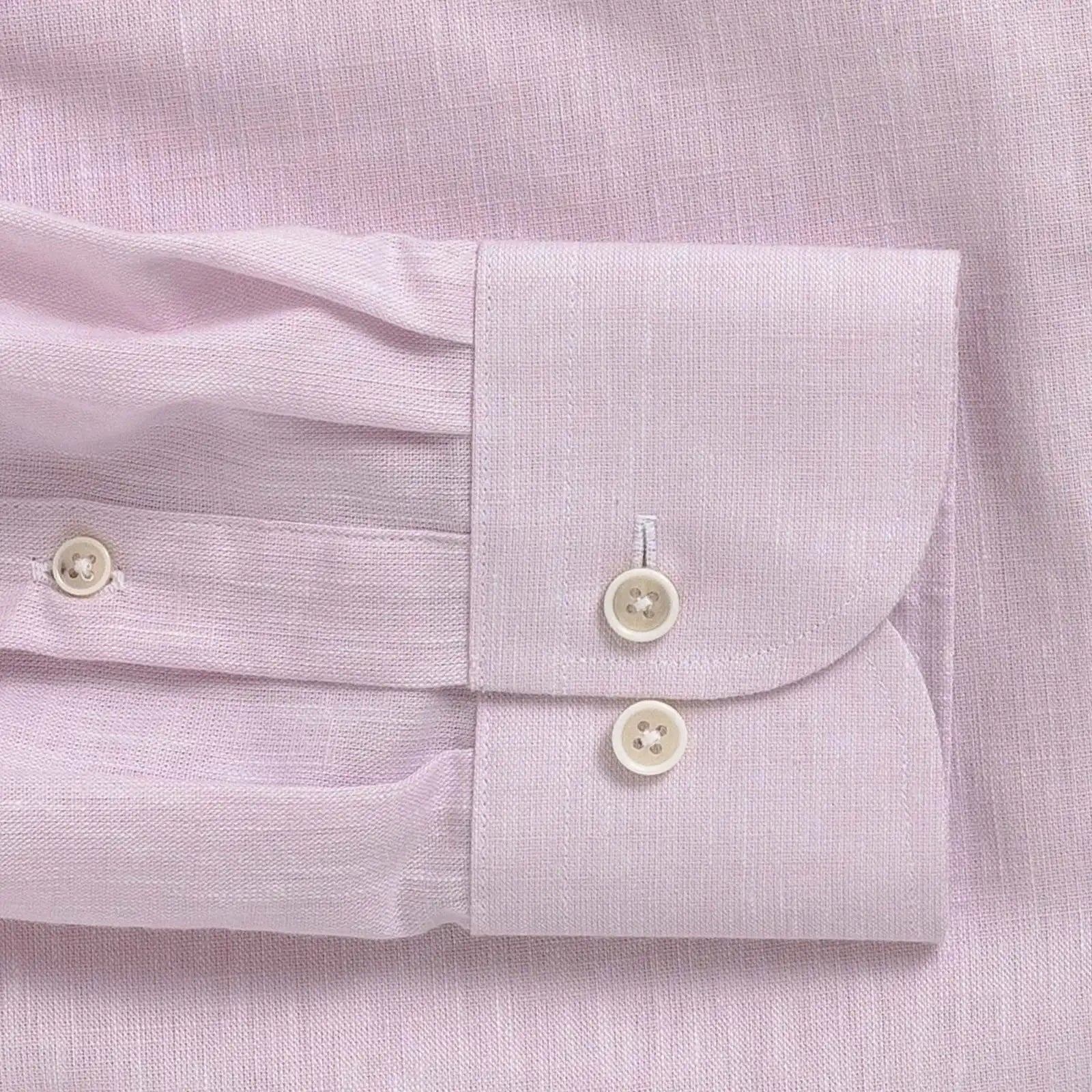 Close-up of a light pink heathered cotton shirt with button details