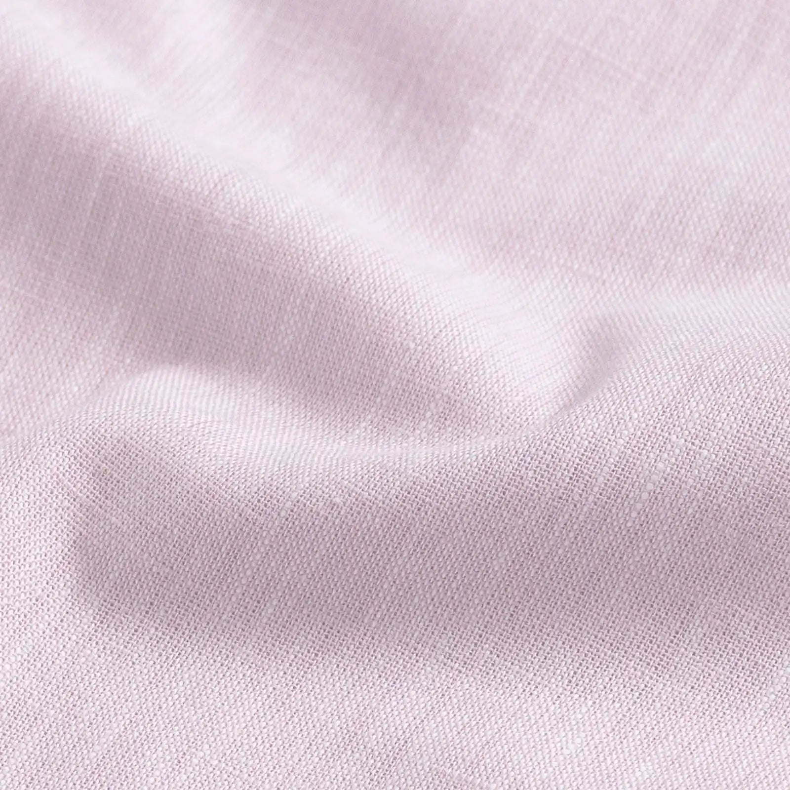 Close-up of light pink fabric texture