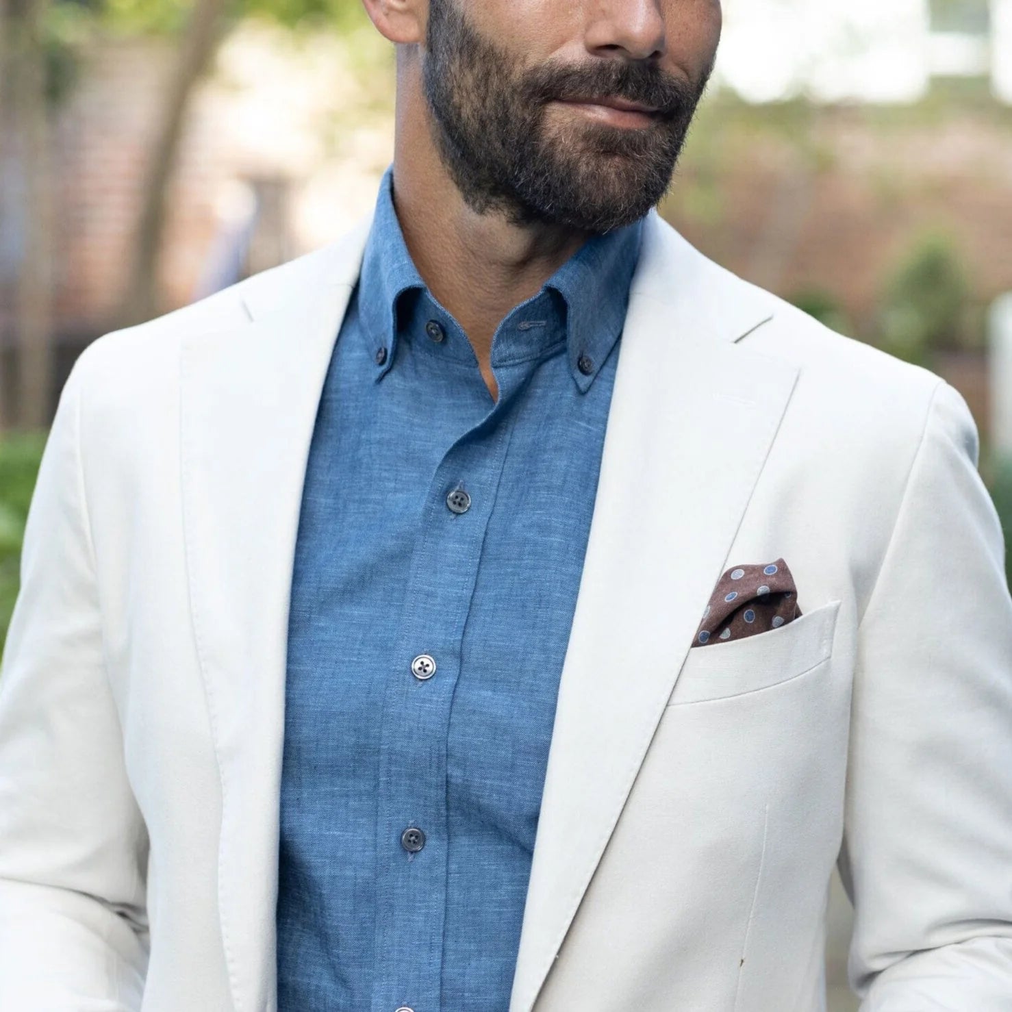 Medium blue Sandoval oxford chambray custom shirt worn by a model under a cream sportcoat