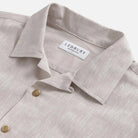 Camp collar detail on the Ecru Sandoval — open, flat-lying collar in slub cotton chambray