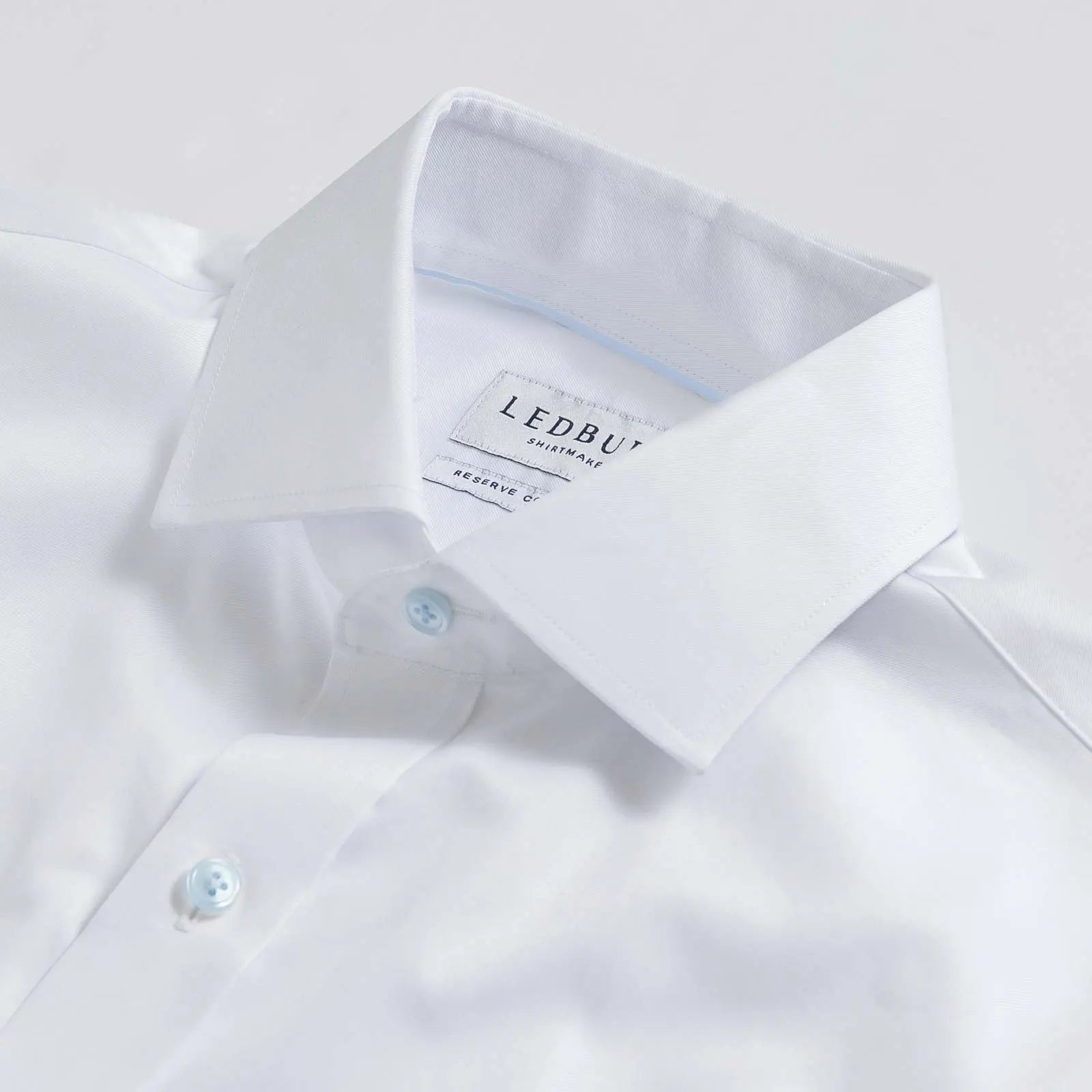 White dress shirt collar with light blue button detail - fine twill shirt