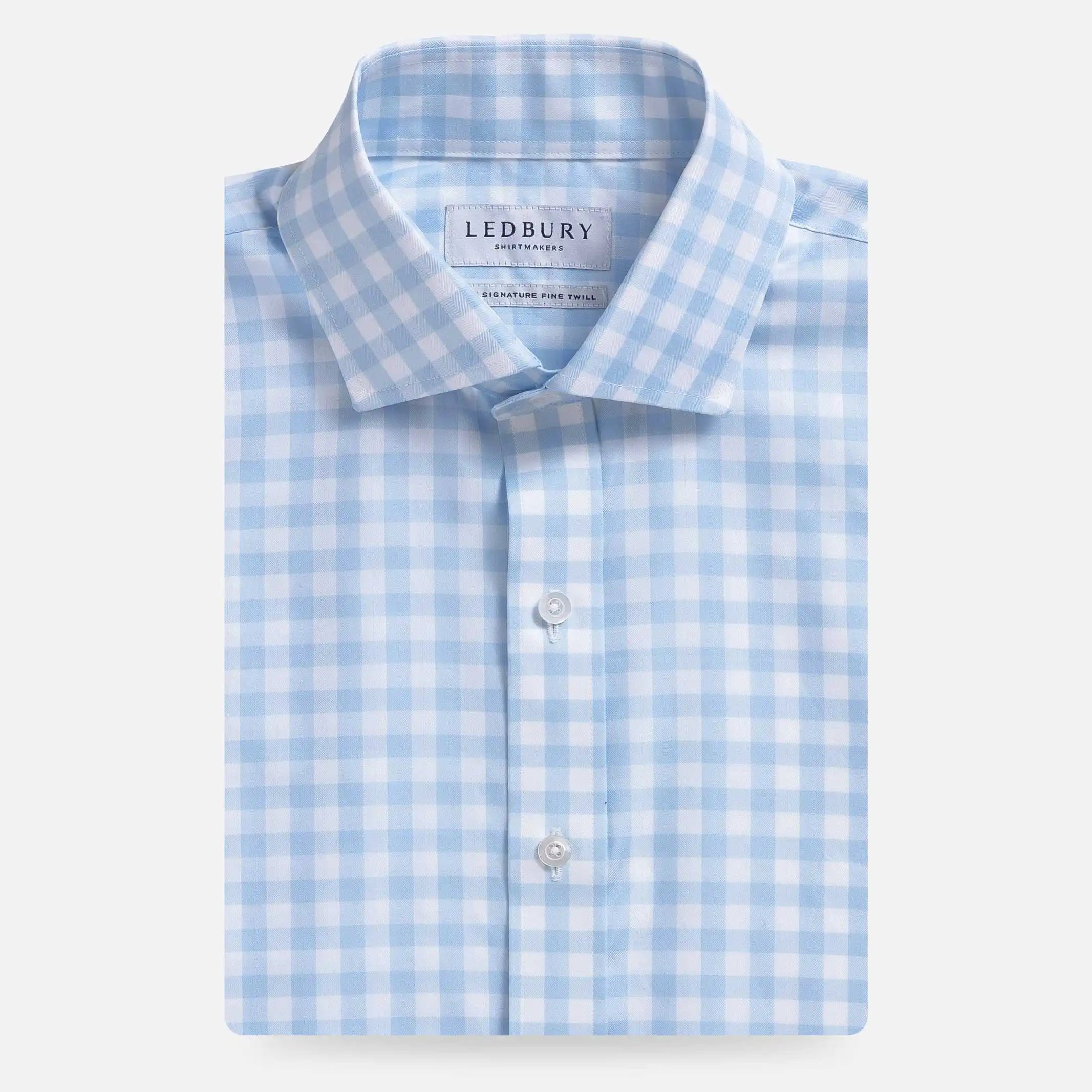 Light blue gingham dress shirt flat lay - classic check pattern fine twill