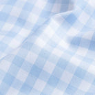 Gingham check fine twill fabric close-up - light blue classic pattern texture