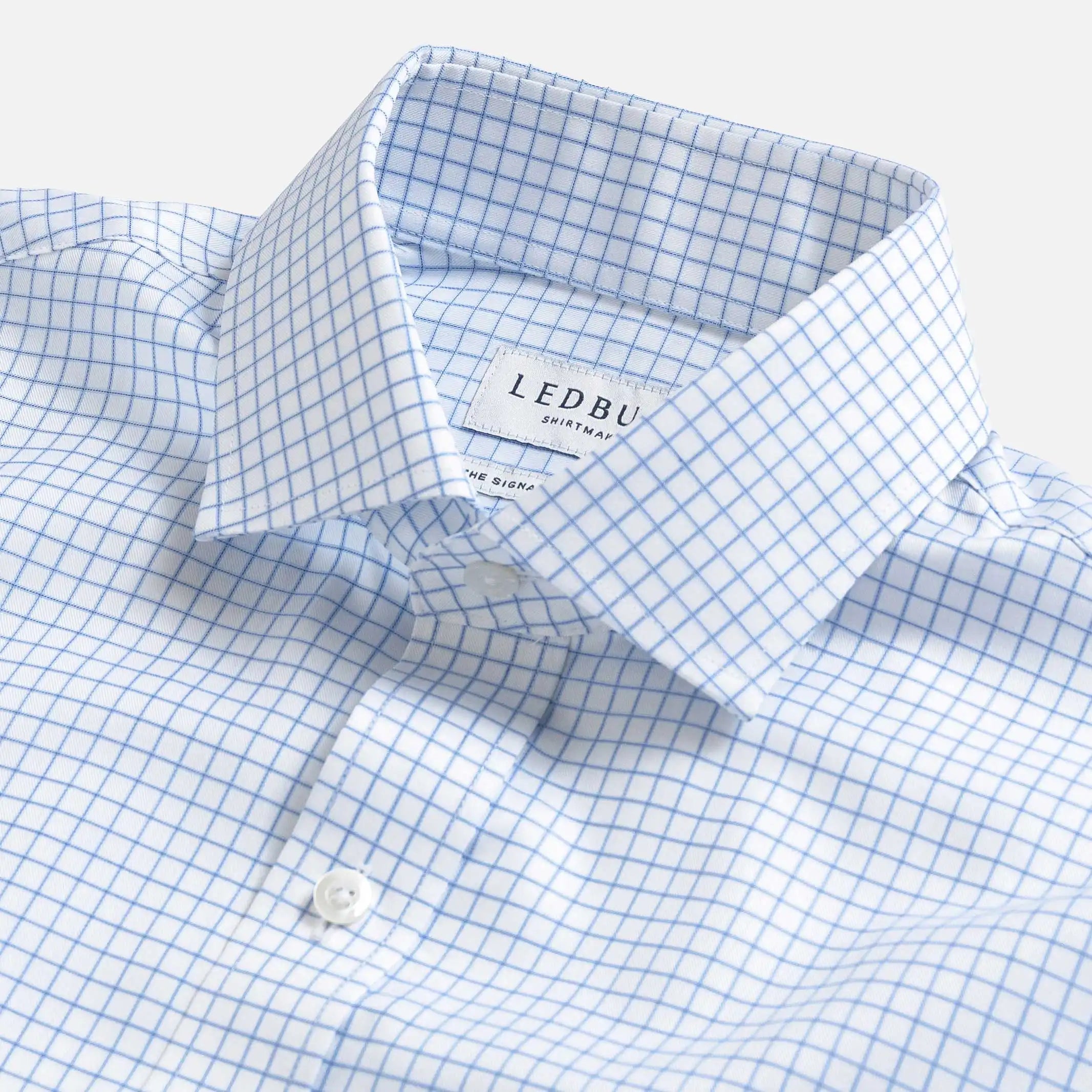 Light blue dress shirt collar with grid check pattern - fine twill detail