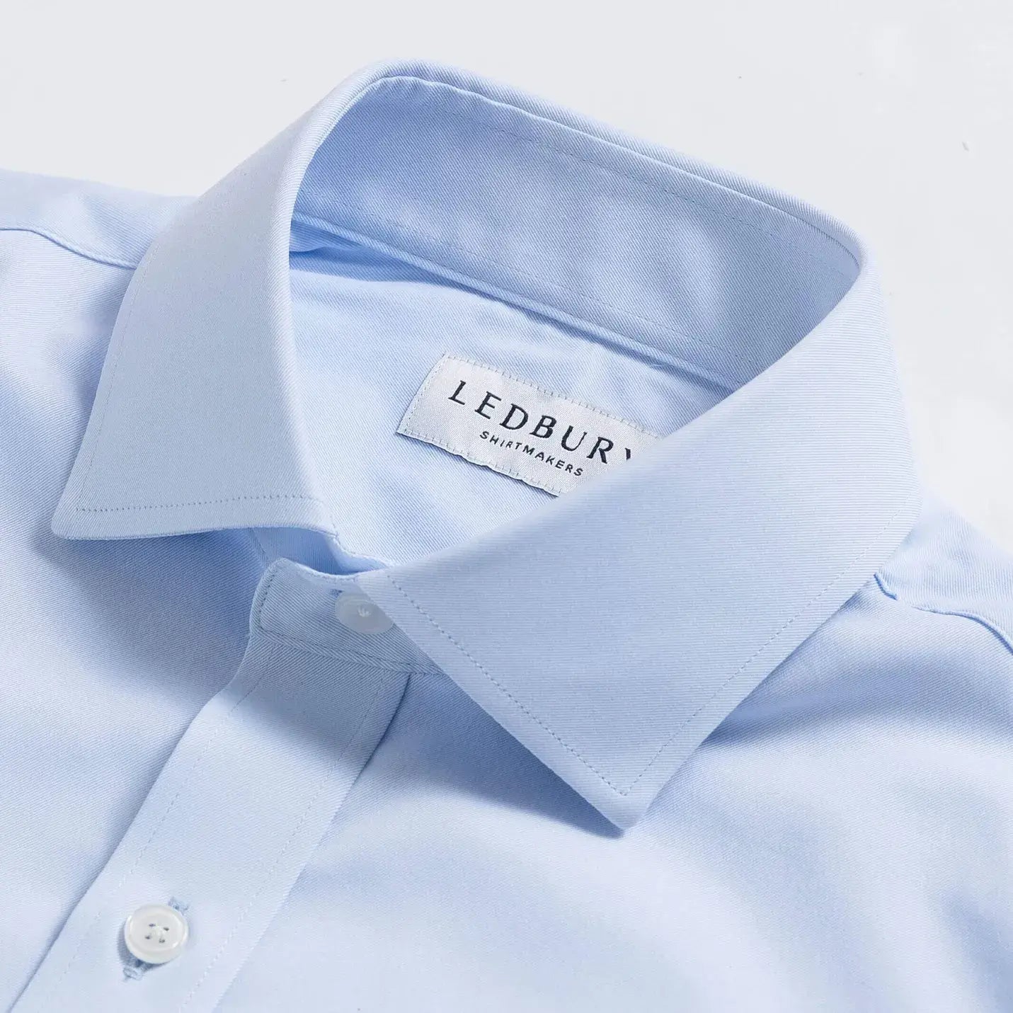 Ice blue dress shirt collar detail - premium performance fabric construction