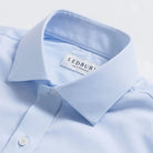 Ice blue dress shirt collar detail - premium performance fabric construction