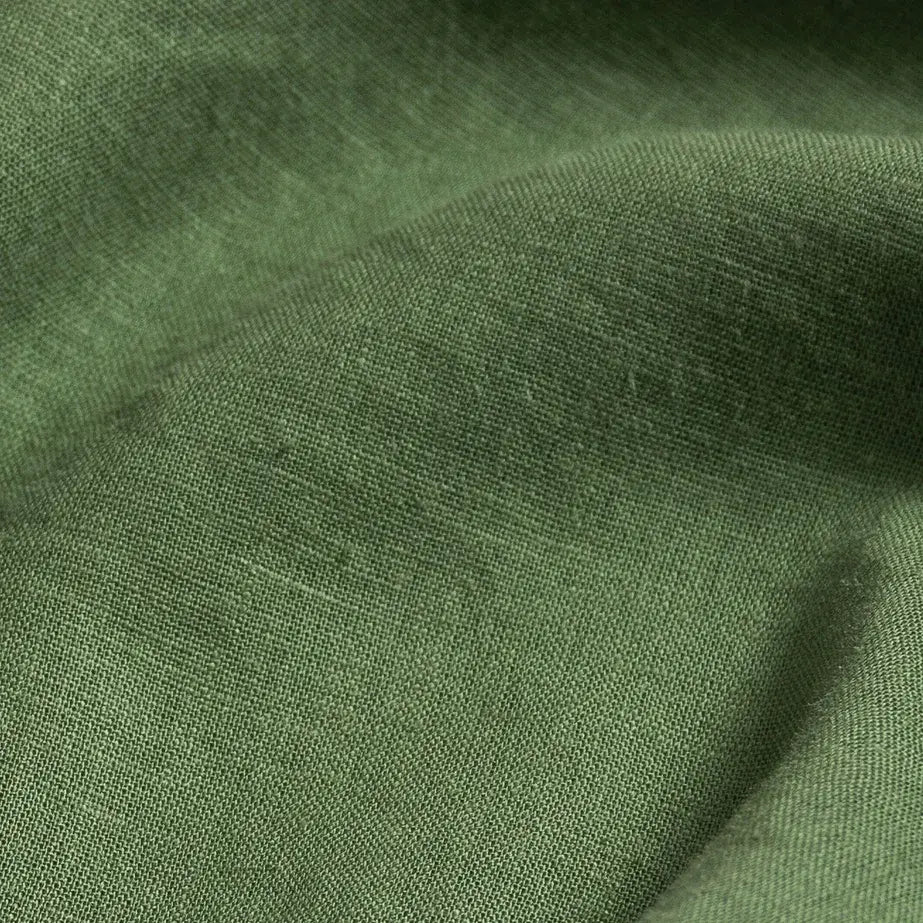Verde green linen viscose fabric close-up - 55% linen 45% viscose Barlotta texture