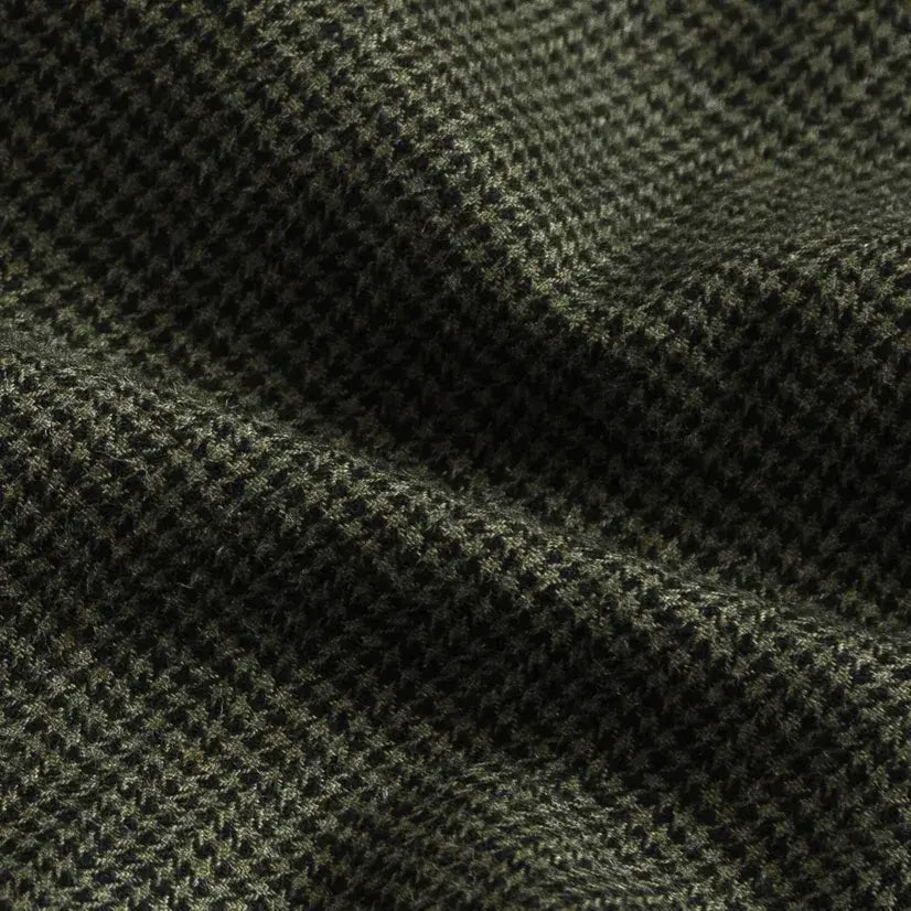 Brushed twill fabric close-up - green houndstooth pattern texture