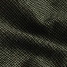 Brushed twill fabric close-up - green houndstooth pattern texture