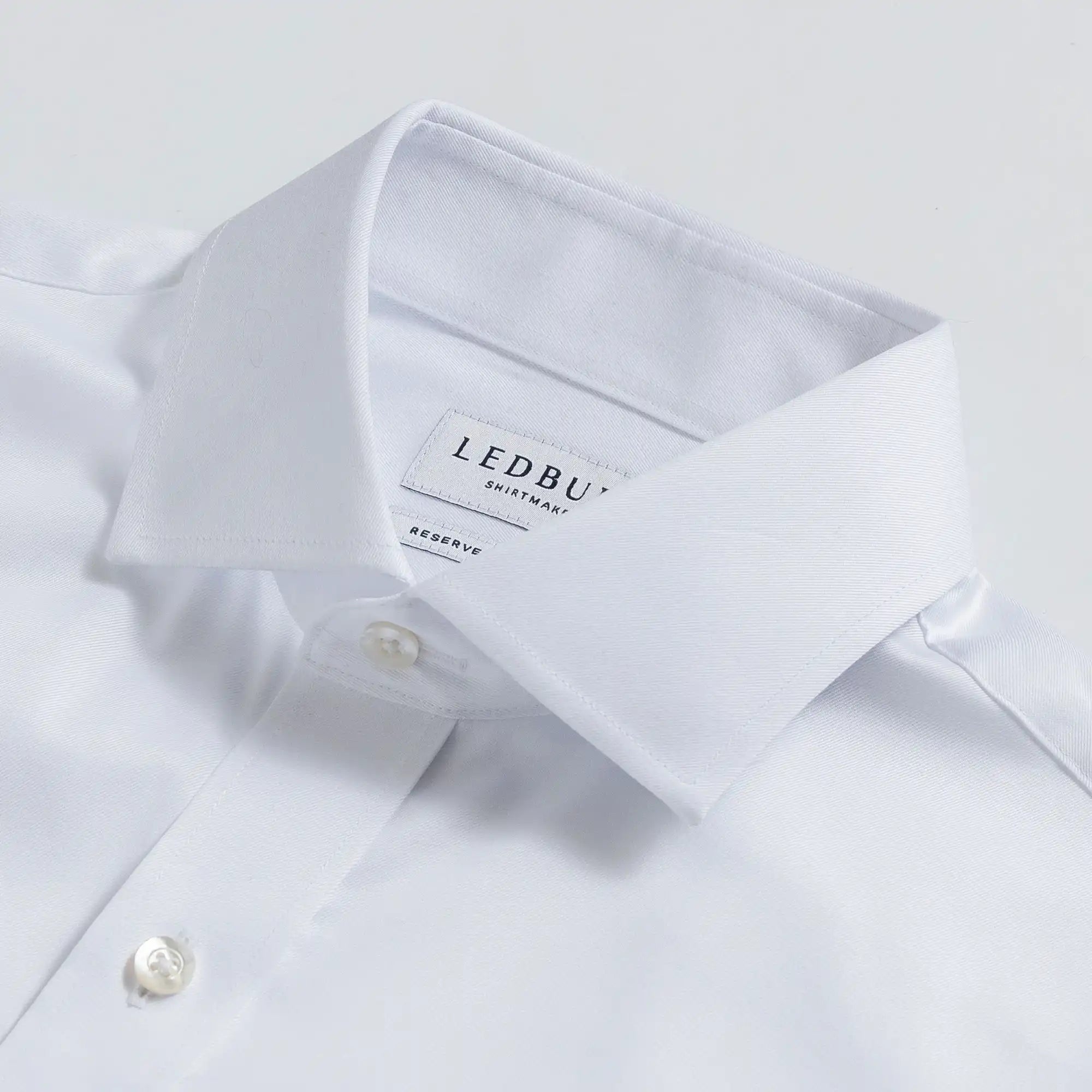 White Thompson wrinkle-resistant dress shirt collar and placket detail
