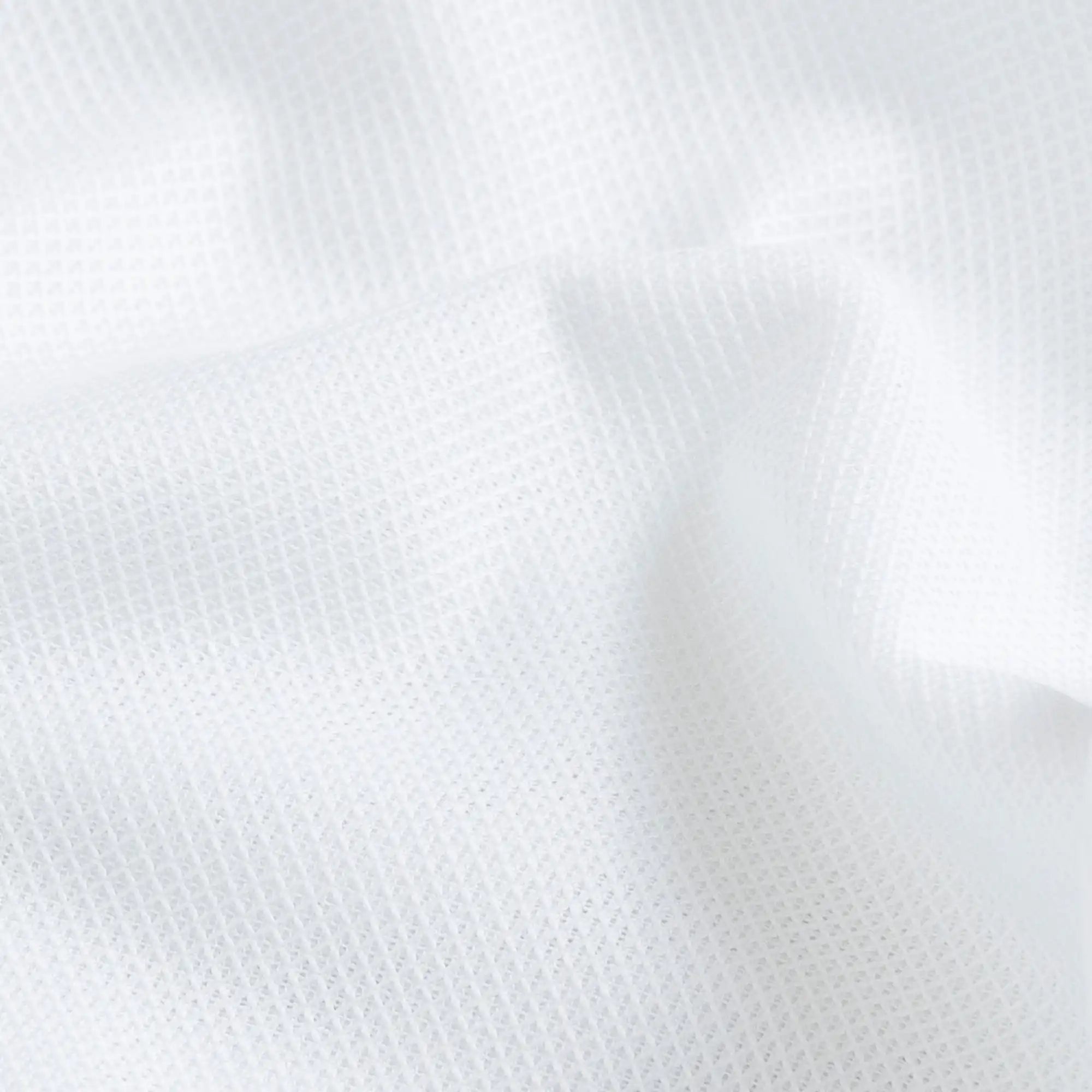 White Giro Inglese open-weave fabric close-up - breathable mesh texture cotton elastane