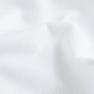 White Giro Inglese open-weave fabric close-up - breathable mesh texture cotton elastane