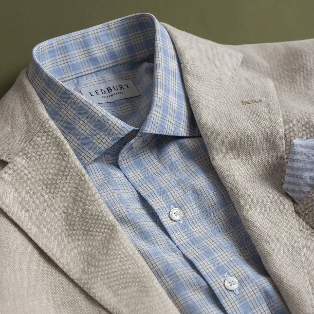 Light blue Chamlin check shirt styled with a tan sport coat - Ledbury custom dress shirt