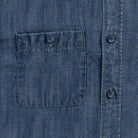 Blue denim utility shirt chest pocket detail - double button-through design