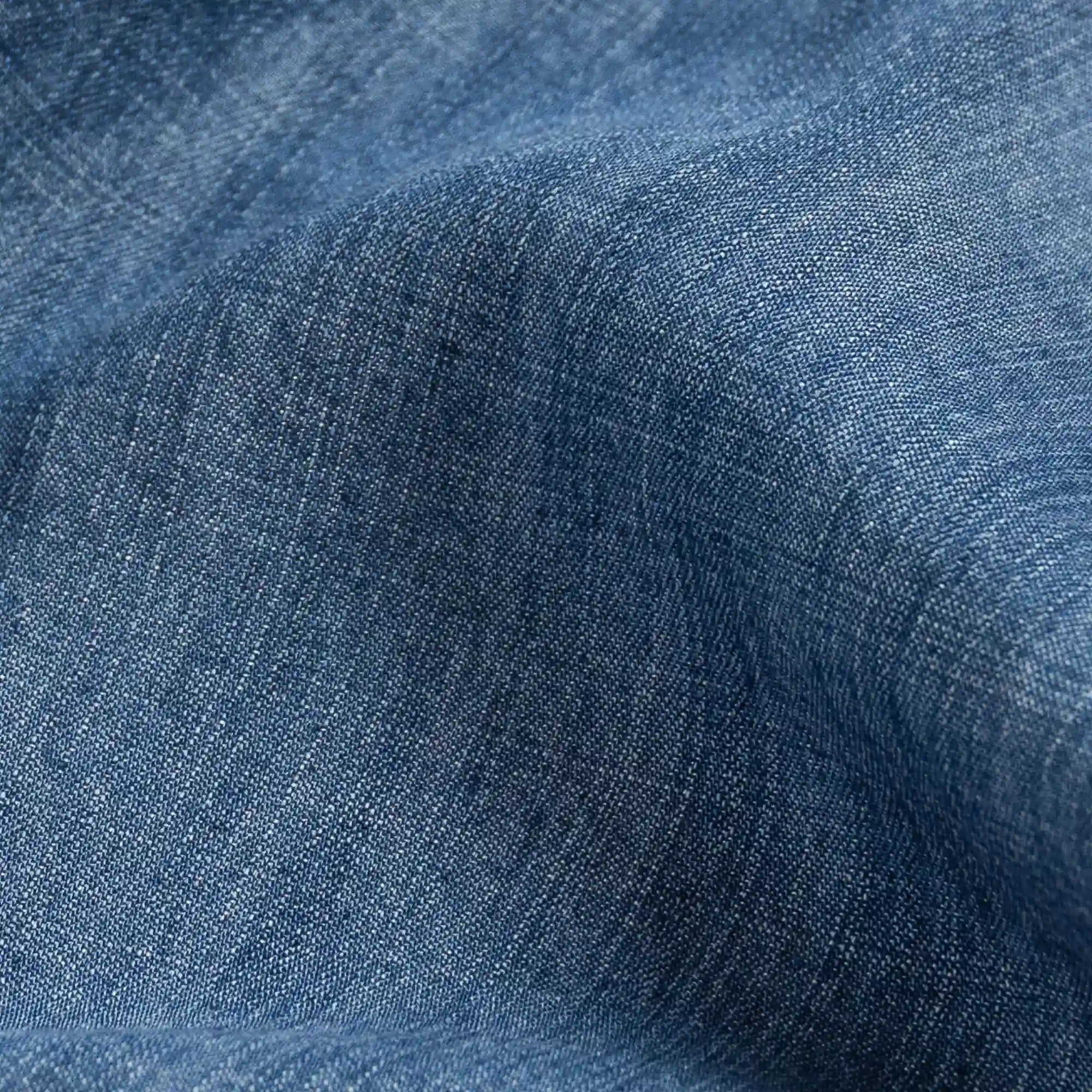 Blue Easton denim fabric close-up - faded indigo Tencel texture