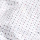 Premium red windowpane twill fabric close-up - luxury dress shirt material