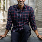 Men's crimson plaid flannel shirt styled with denim - casual fall outfit