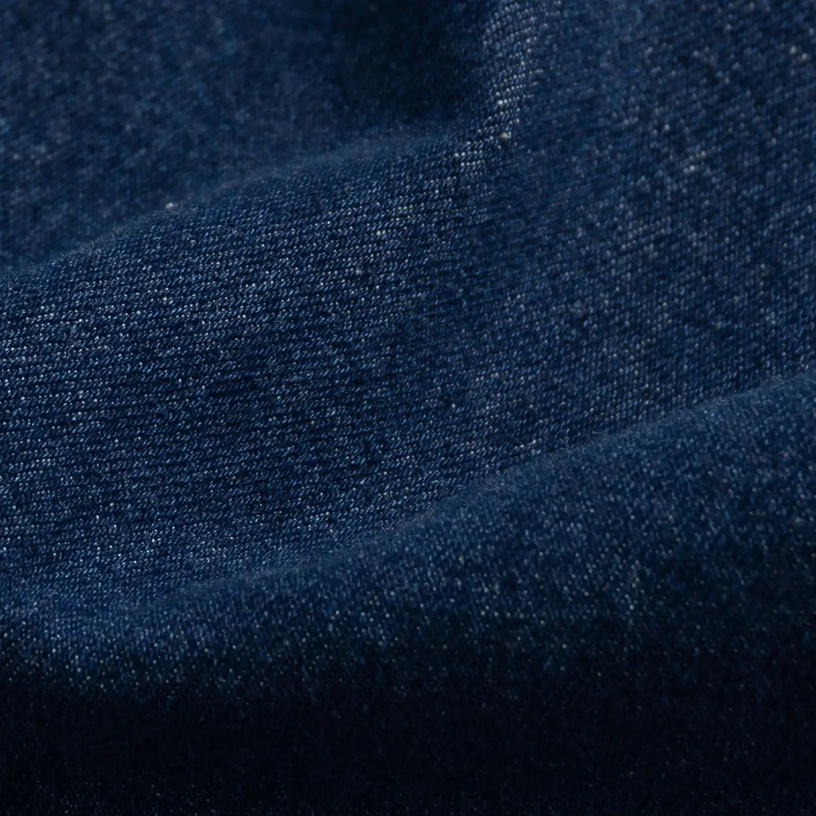 Indigo stretch denim fabric close-up - 98% cotton 2% elastane texture