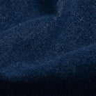 Indigo stretch denim fabric close-up - 98% cotton 2% elastane texture