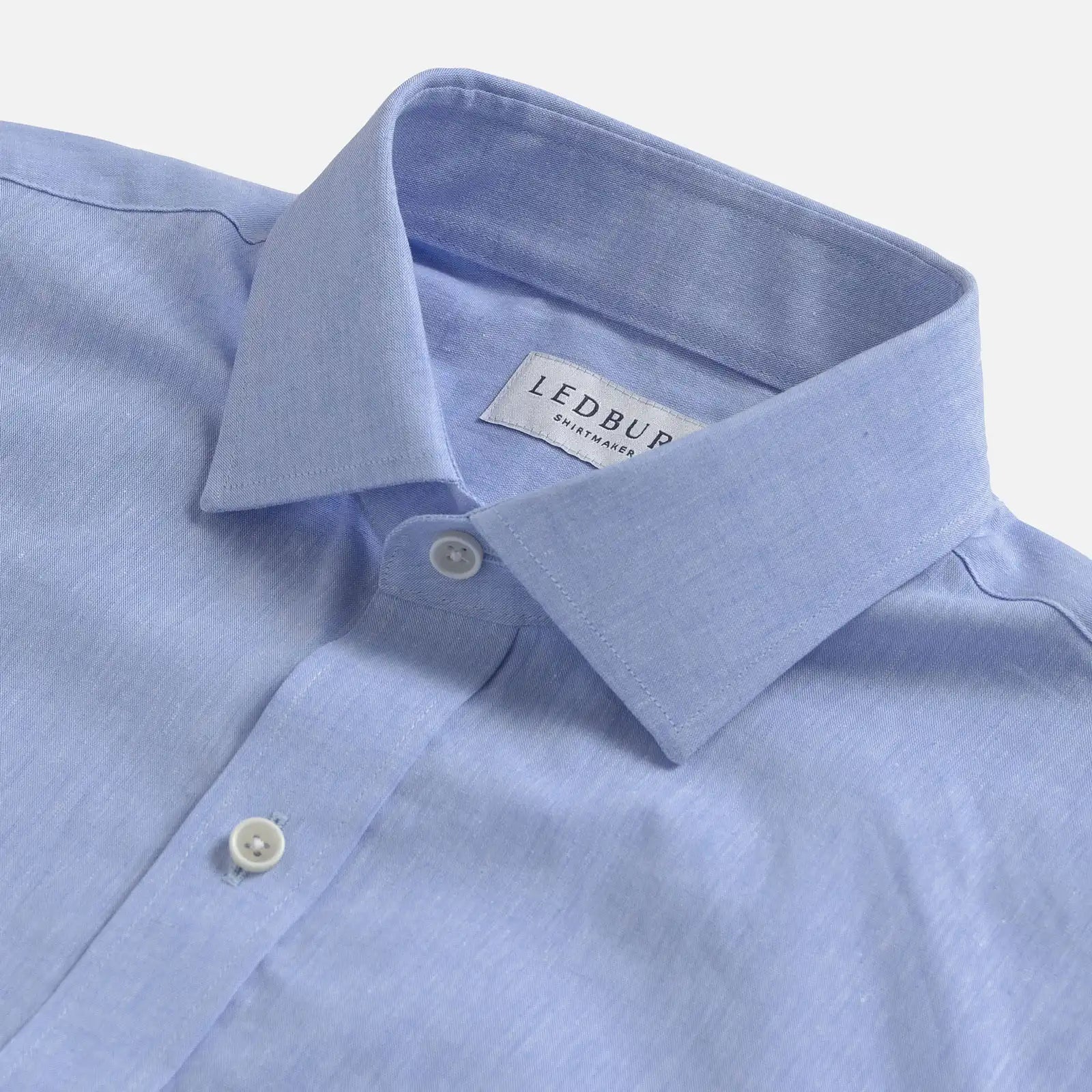 Close up of the collar on a men's cotton/linen light blue shirt by Ledbury
