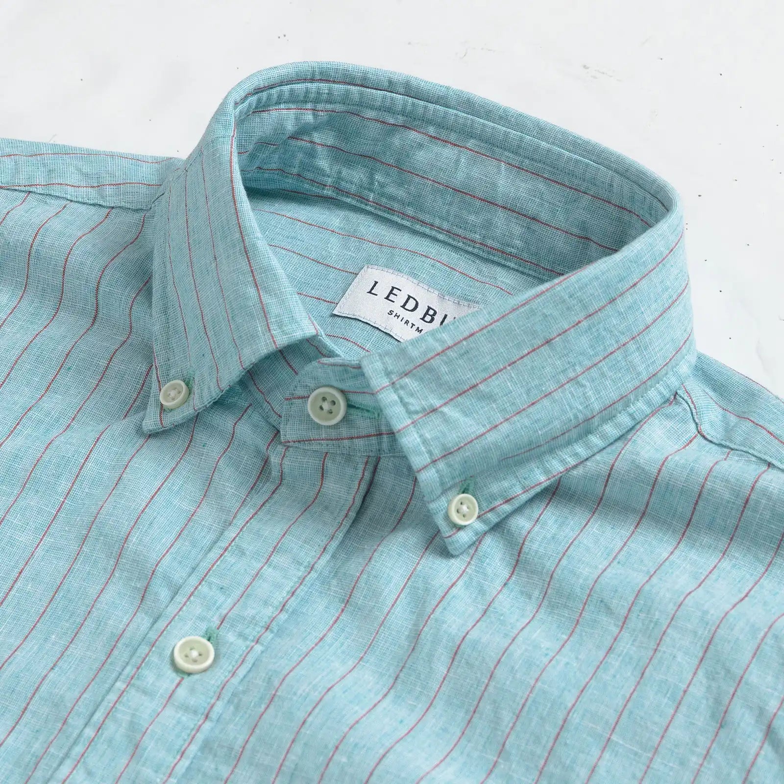Close-up of collar detail on the Sea Green Barretto Stripe cotton-linen shirt