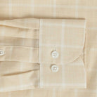 Sleeve detail of an Italian Albini light butter yellow and white checkered button down shirt