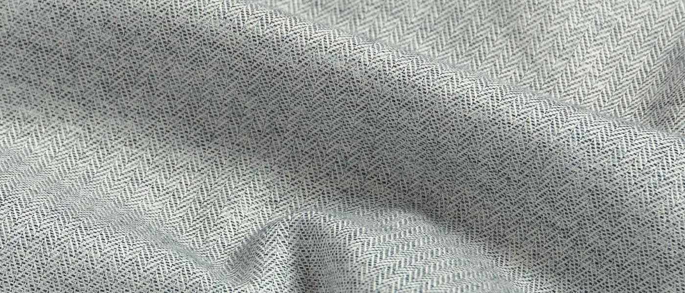 Close-up of light gray fabric with a subtle herringbone pattern