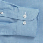 Bright blue dobby dress shirt cuff and sleeve detail