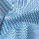 Custom dress shirt bright blue dobby pattern close-up