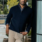 Men's Navy Ashton quarter-zip sweater styled over a button-down — lifestyle shot