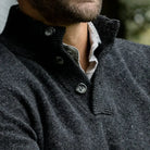 Three-button ribbed mock collar detail on the Dark Grey Brewer Mock Neck Sweater