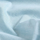 Green chambray fabric close-up texture - 100% cotton Hucks shirt weave