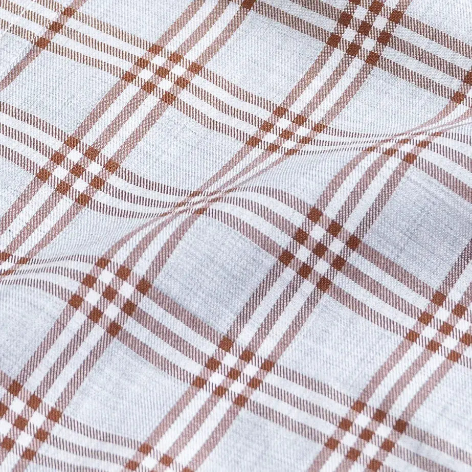 Rustic brown Arnett plaid fabric close-up - cotton twill chambray effect
