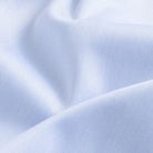 Non-iron fine twill fabric in light blue - wrinkle-resistant cotton texture
