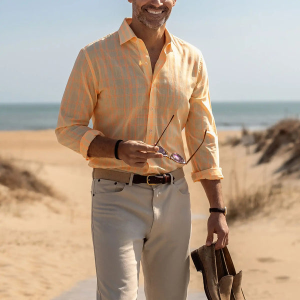 Man wearing the Yellow Torello Check custom shirt standing on the beach 
