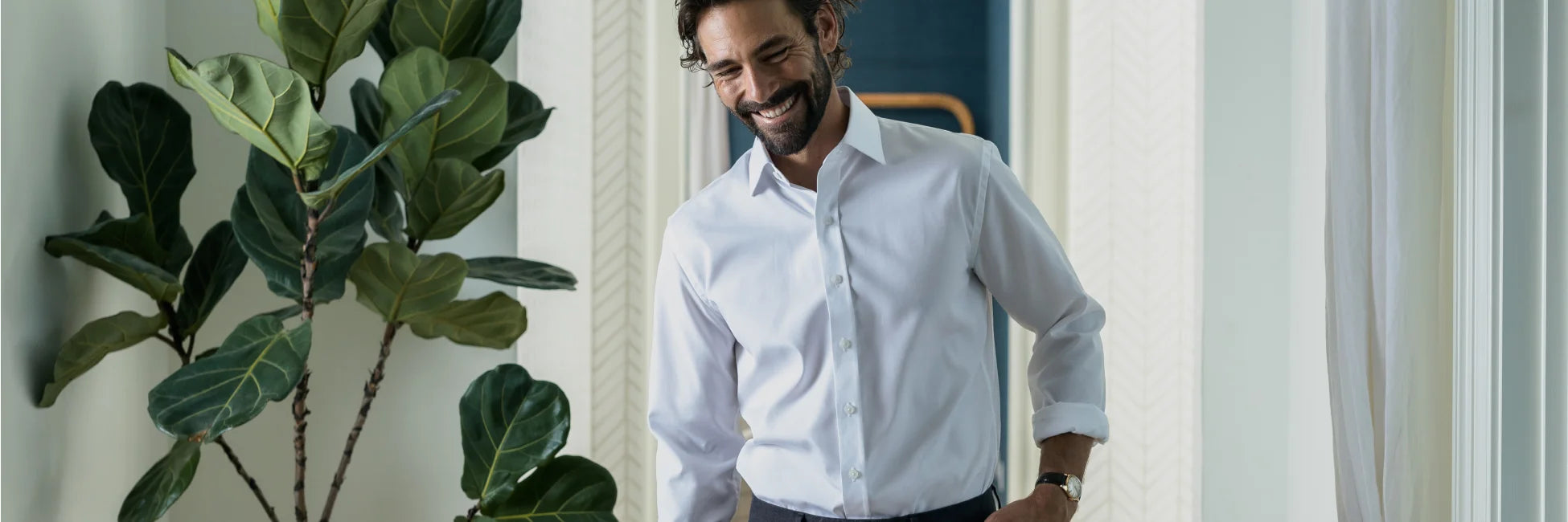 Male model wearing a white dress shirt from Ledbury