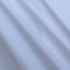 White Canon performance twill fabric stretching close-up - nylon spandex blend texture