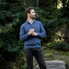 Blue Heather Brewer Mock Neck Sweater worn outdoors in lifestyle setting