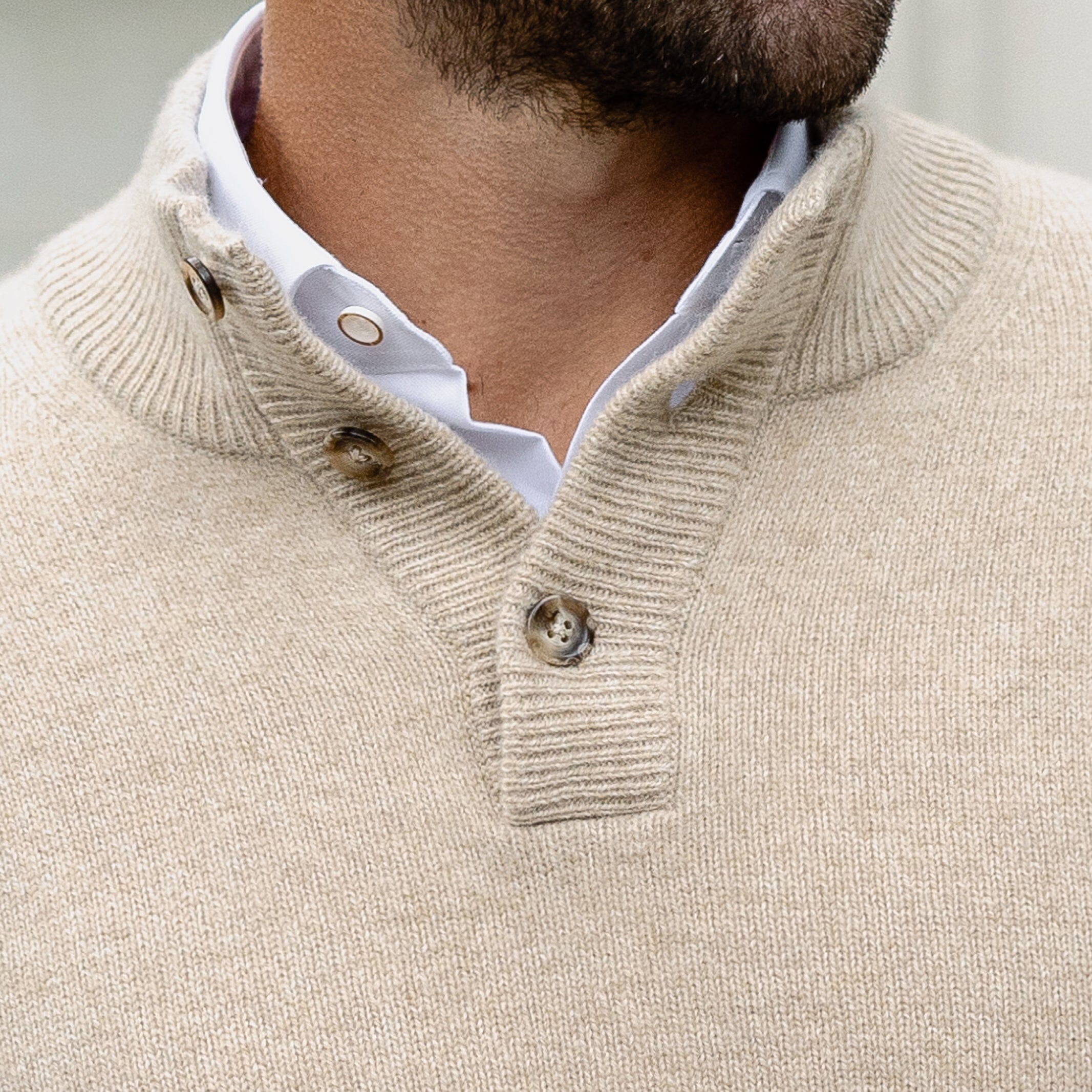 Three-button ribbed mock collar detail on the Camel Heather Brewer Mock Neck Sweater